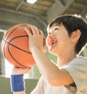 Boy shooting a basketball