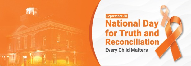 An image of Town Hall lit up in orange with the words: National Day for Truth and Reconciliation