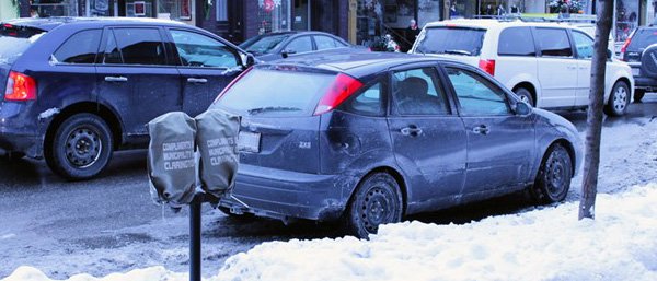 Downtown Bowmanville parking meter covered with a bag