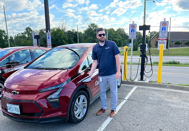 A Clarington staff member charges one of the new fleet EVs.