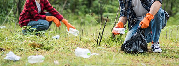 People picking up waste outside