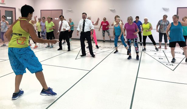 Member of Provincial Parliament for Durham Todd McCarthy (centre) and Minister of Seniors and Accessibility Raymond Cho (left of centre) participated in a Zumba class at the Bowmanville Older Adults Association.