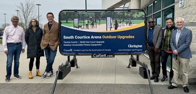 Left to right: Regional Councillor Willie Woo, Councillor Margaret Zwart, Councillor Lloyd Rang, Regional Councillor Granville Anderson, Councillor Sami Elhajjeh, and Mayor Adrian Foster announce new outdoor upgrades at South Courtice Arena. 