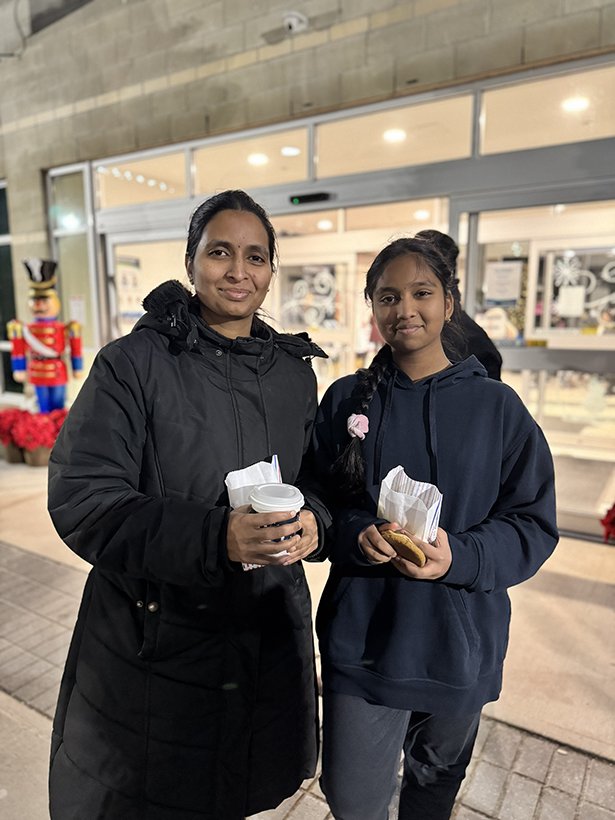 Mom and daughter enjoy cookies and hot chocolate at the Courtice Tree-Lighting Ceremony.