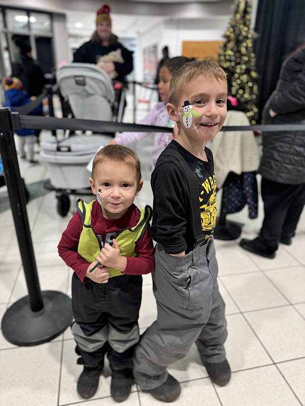 Two young boys with snowman face paint at the Courtice Tree-Lighting festivities.
