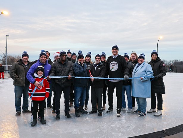 Mayor, Members of Council, Members of the Accessibility Advisory Committee and staff cut the ribbon to officially open the new ice rink.