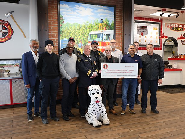 Mayor Adrian Foster, Council Members, Clarington staff and firefighters, with franchise owner Deepak Daryani as well as Firehouse Subs representatives gather in gratitude for the generous support protecting local firefighters. 