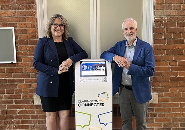 Chief Administrative Officer Mary-Anne Dempster and Clarington Mayor Adrian Foster with a Clarington Connected engagement kiosk in Town Hall.