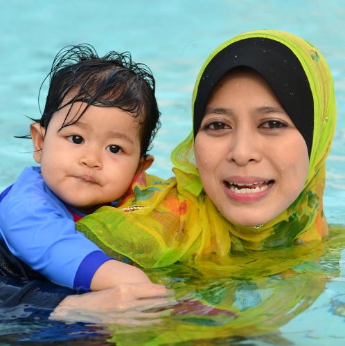 Parent and child in the pool.
