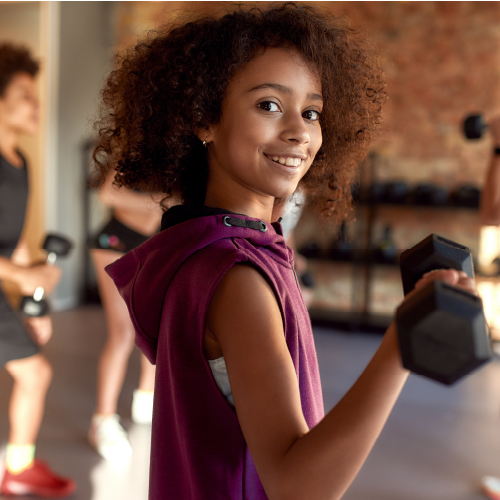 Teenager practising with hand weights