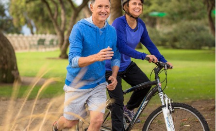 Healthy older couple exercising