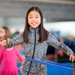 Child playing with a hula hoop.