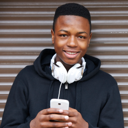 Teenager texting on a cell phone