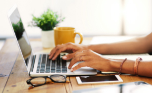 person typing on a laptop