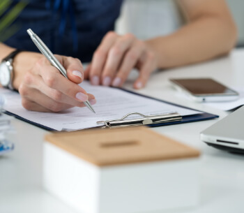 Person signing a form