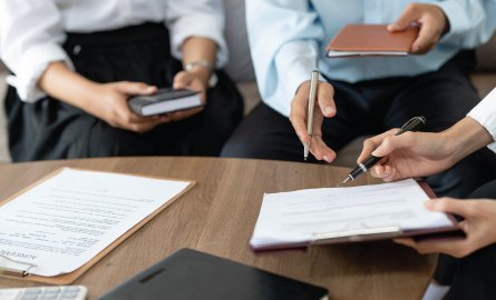 Real estate lawyer explaining contract to client.