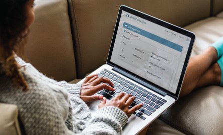Woman banking on a laptop