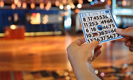 A person holding a Bingo card