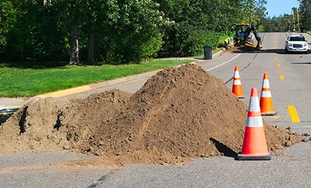 A pile of dirt on the road