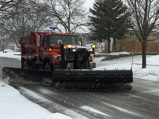 Snow plow on a Clarington street in winter conditions.
