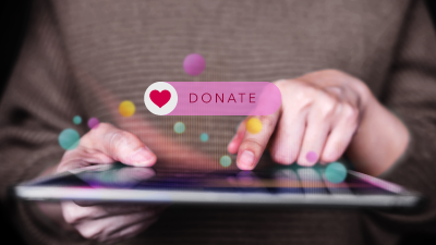 Making Donate via Internet on Digital tablet.