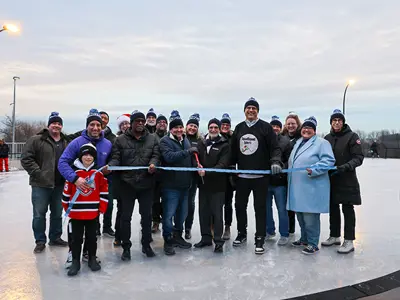 Mayor, Members of Council, Members of the Accessibility Advisory Committee and staff cut the ribbon to officially open the new ice rink.