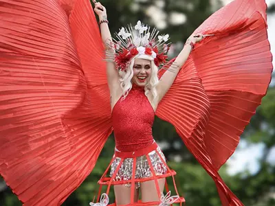 Stilts performer dressed in a red and white costume for Canada Day.