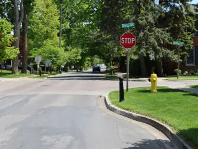 A roadway with a curb protruding from the right side.