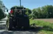 Clarington tractor cutting the grass on the side of a road.
