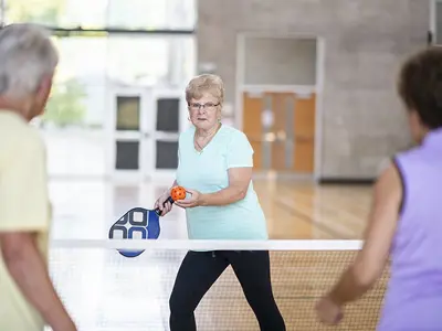 Older adults playing pickleball at Diane Hamre Recreation Complex.