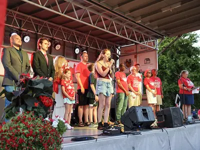 Clarington leaders and dignitaries on the main stage for the singing of 'O Canada.