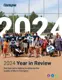 Cover image for Clarington's 2024 Year in Review: people stand on a baseball field with trees and a fence; text highlights community impact.