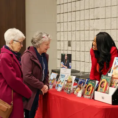Psychotherapist & Author Thalia Bennett from Reflections Counselling and Psychotherapy Services assists shoppers at her booth.