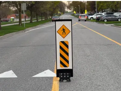 Roadway with flexible signs bolted.