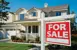 For sale sign in front of a house