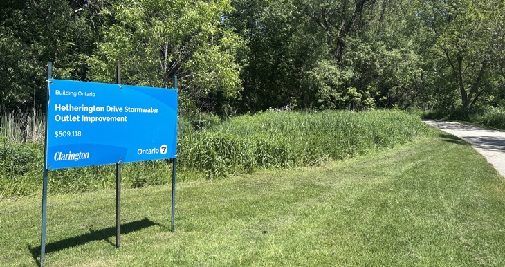 Hetherington Drive Stormwater Outlet Improvement sign beside the trail.