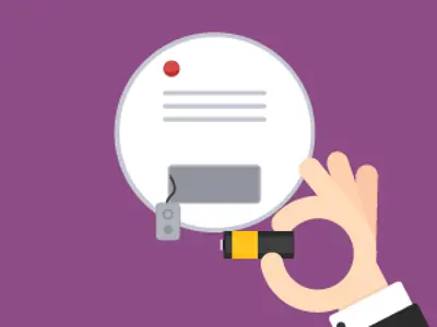 Graphic of a smoke alarm with a hand inserting a battery.