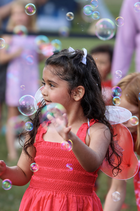 A child plays in bubbles
