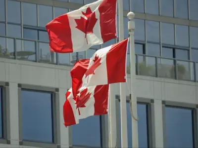 Picture of three Canadian flags.