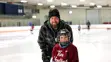 Father and son at public skate.