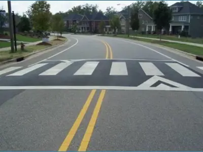 A raised crosswalk on a street.